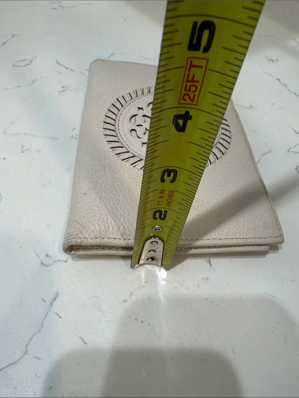 Brighton Cream Pebbled Leather Ferrara Fold Wallet with Embossed Medallion